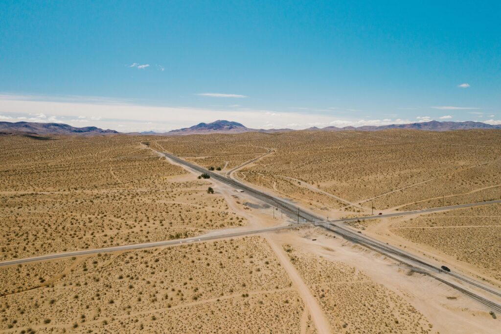 Types of roads shown in a desert landscape with long straight highways and connecting rural paths.