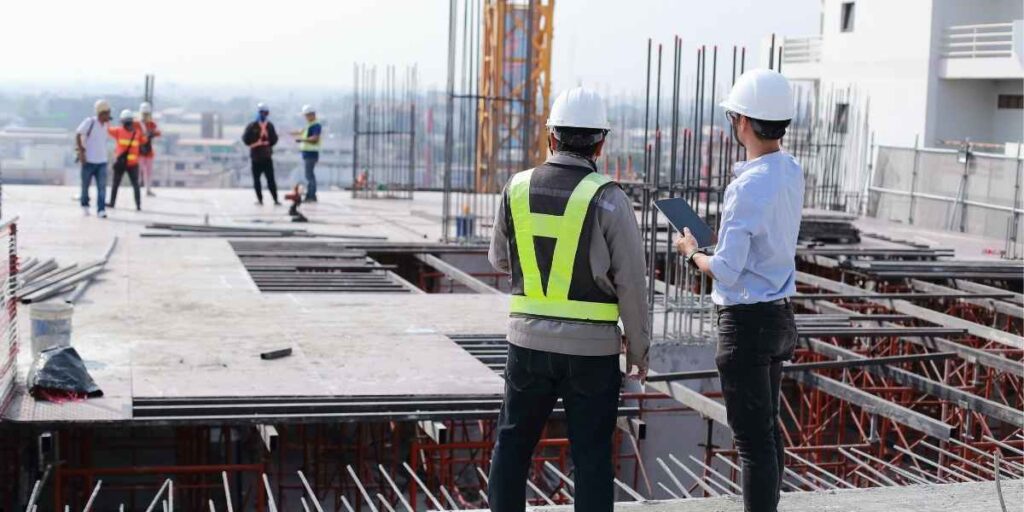 engineers conducting construction site safety inspection during infrastructure project