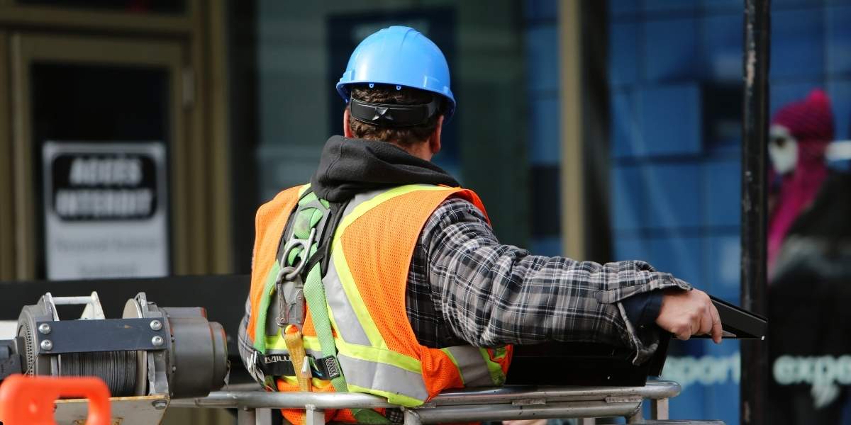 construction workers wearing safety equipment at infrastructure construction site