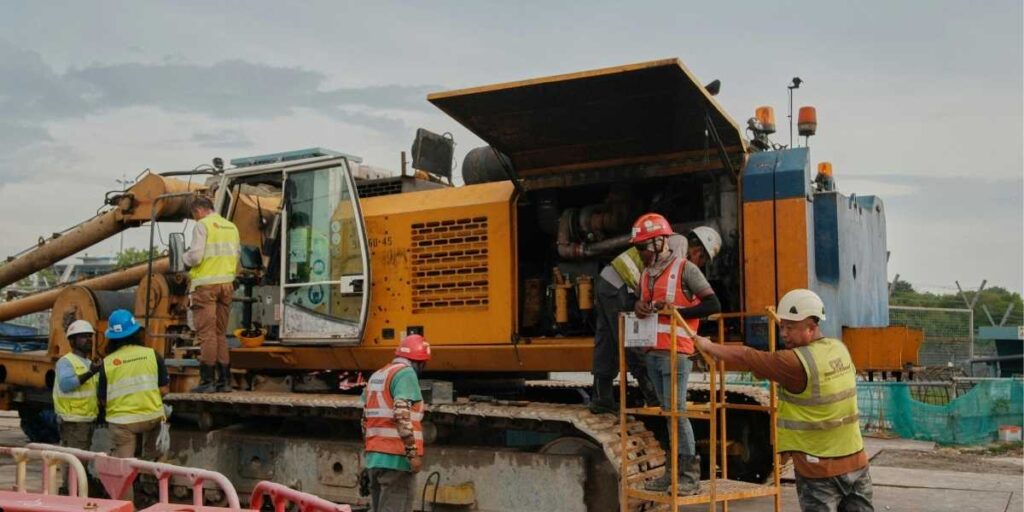 heavy machinery operating safely at a construction infrastructure project